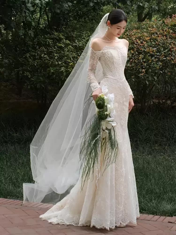 French-style off-the-shoulder lightweight wedding dress featuring exquisite lace