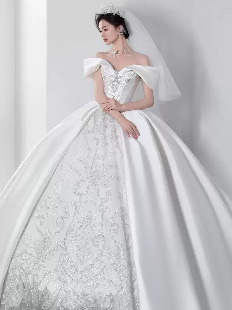 Off-the-shoulder satin wedding gown featuring French vintage style and premium texture